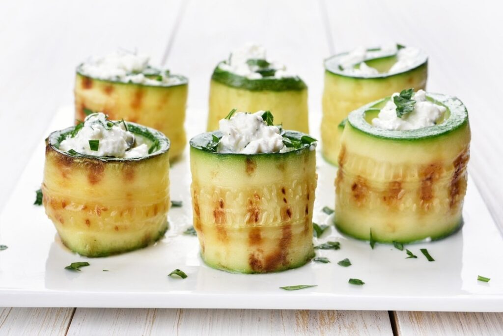 Sliced ​​zucchini and cheese served on a white plate