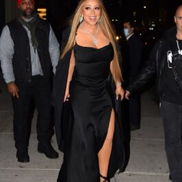 Mariah Carey poartă o rochie neagră pe corp alături de un colier strălucitor și elegant