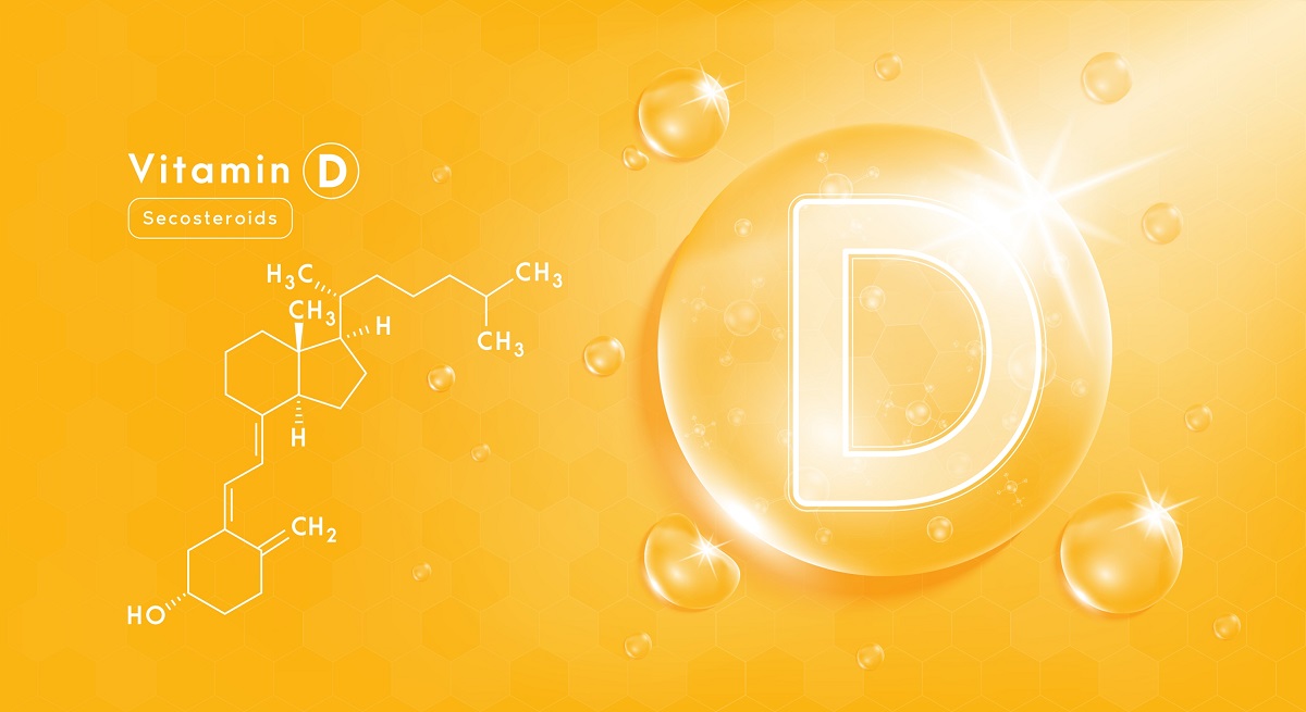 O fotografie care lustrează vitamina D pe un fundal orange
