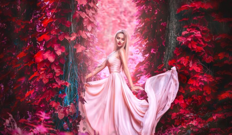 O femeie frumoasă care poartă o rochie roz și pozează într-o pădure roșie pentru a ilustra trăsăturile dominante ale personalității pe care o are