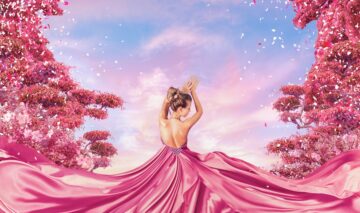 O femeie frumoasă care poartă o rochie roz și simbolizează una dintre acele zodii energice