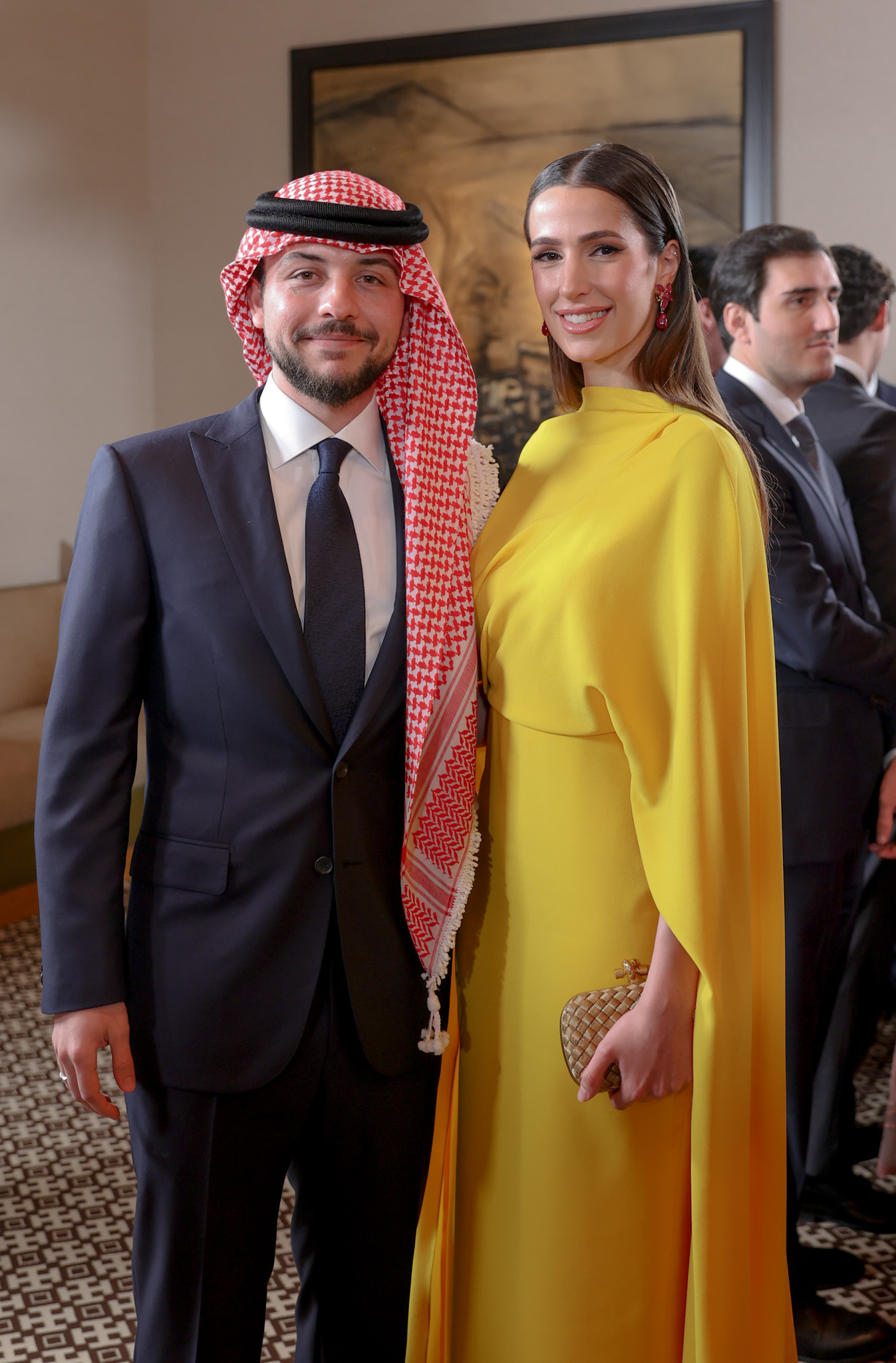 Prințesa Rajwa și Prințul Hussein al Iordaniei în timp ce poează împreună la un eveniment public